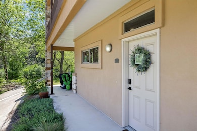 View of exterior entry featuring stucco siding