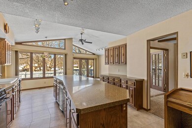 Look at this amazing kitchen! The exceptional windows at the far end look out over the pool and flood the space with natural sunlight.