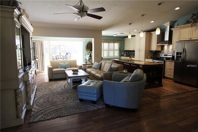 Open Floor Plan..... Living room and Kitchen with beautiful laminate wood flooring and vaulted ceiling