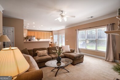 From the family room, enjoy an open view into the kitchen, enhanced by abundant natural light streaming in from the backyard, creating a warm and inviting atmosphere
