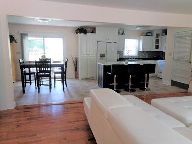 View from living room to kitchen and dining area