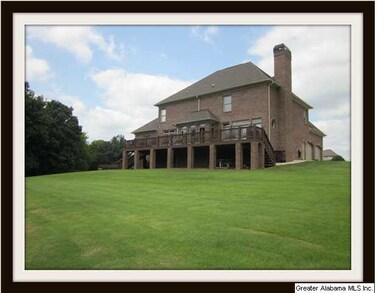 View of back of house with large deck.