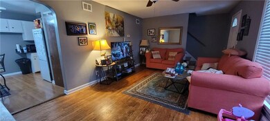 Spacious living room with hardwood floors