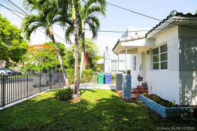 Front Yard with gated parking for both tenants. Ea