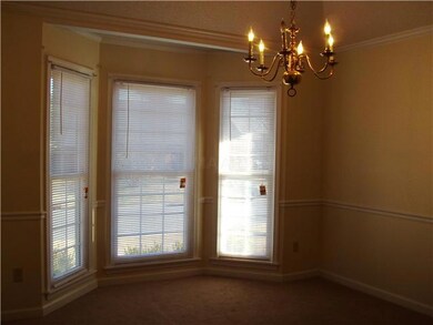 seperate Dining room with a bay window