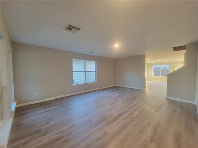 Spacious living room with a lot of natural light!