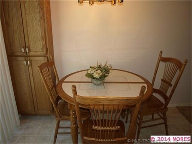 Eating area in kitchen with a food storage cabinet