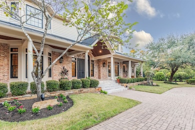 The inviting front porch spans the entire length o