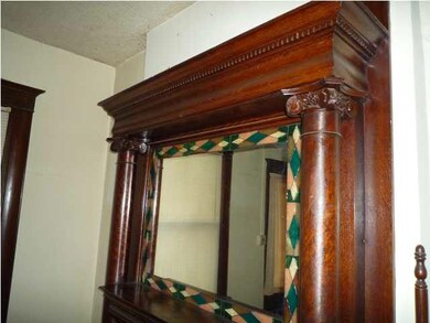 Detailed woodwork in the fireplace surround