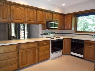 Many cabinets in the large kitchen area