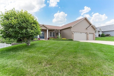 Ranch-style house featuring an attached garage, driveway, a shingled roof, and brick siding