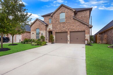 Beautiful curb appeal with manicured landscaping and with plenty of driveway space.