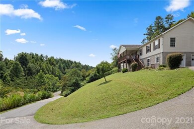 THIS BEAUTIFUL HOME IS SURROUNDED BY MATURE TREES 