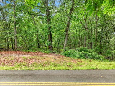 View of yard featuring a forest view