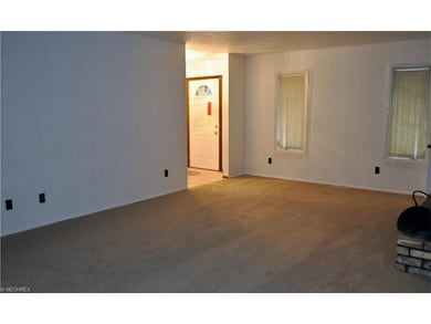 Large, bright family room with wet bar, fireplace and access to backyard