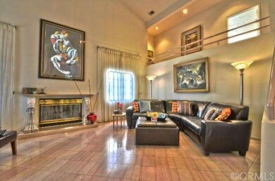 Formal Living Room with Gas Fireplace and Balcony