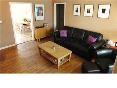 Cozy living room with hard wood floors.