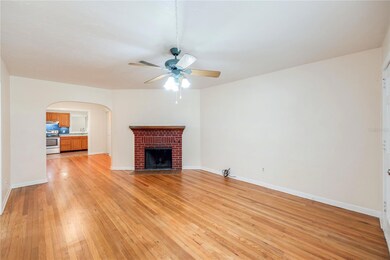Living room with wood burning fireplace.