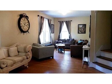 Living Room. Owners Unit - Gleaming Hardwood Floor
