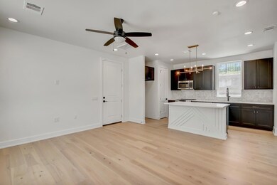 Kitchen featuring stainless steel microwave, deco