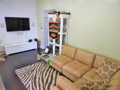 Living room area. Note the wood flooring throughou