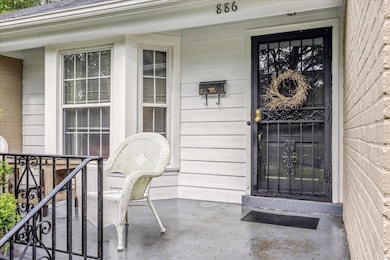 View of exterior entry with covered porch