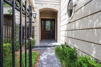 The property has a gated entry to the front door.