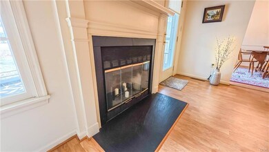 Living Room w/ fireplace and access to walkout pat