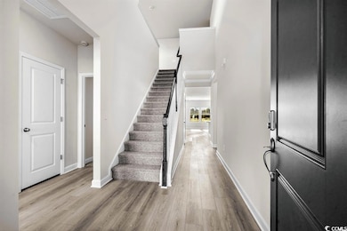 Entrance foyer featuring light wood-style floors, 