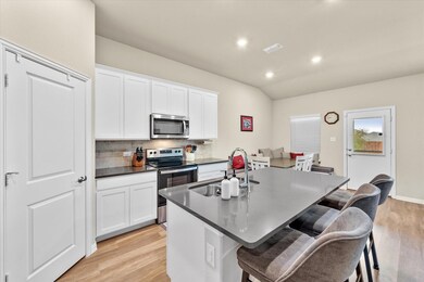 Stainless Steel appliances and a walk in pantry.  