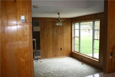 The den features built-in shelves