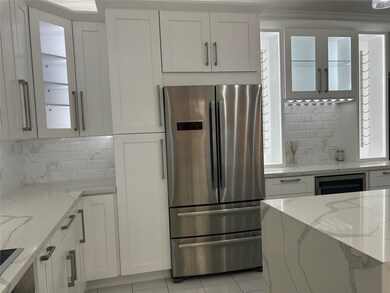 Some kitchen cabinets feature clear fronts with interior lighting, perfect for displaying elegant dishware.