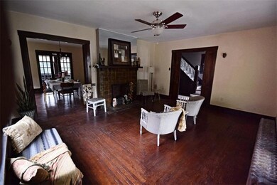 Living Room     Oak pocket doors frame the opening