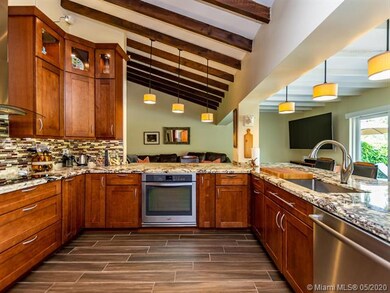 KITCHEN OVERLOOKING THE FAMILY ROOM