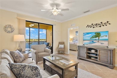 Living room with ceiling fan, crown molding, light