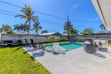 View of pool with a yard and a patio