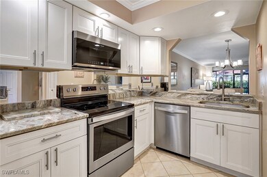 Kitchen with sink, crown molding, a notable chande