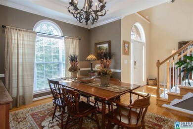 Gorgeous arched windows, hardwood floors in this e