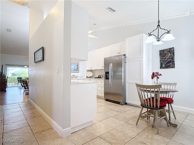 Kitchen with pendant lighting, a notable chandelie