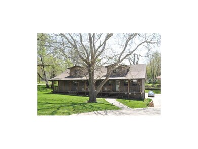 Long covered porch is just the beginning of this h