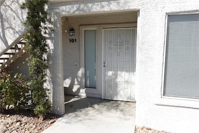 Doorway to property featuring stucco siding