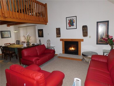 Family room with fireplace and view of loft