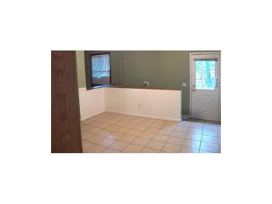 ANOTHE VIEW OF THE DINING AREA, DOOR HEADING OUT T