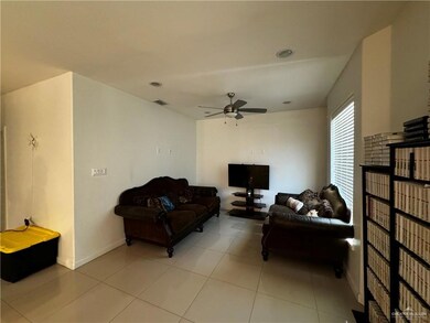Tiled living room with ceiling fan
