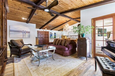 Formal Living Room with gas fireplace, vaulted woo