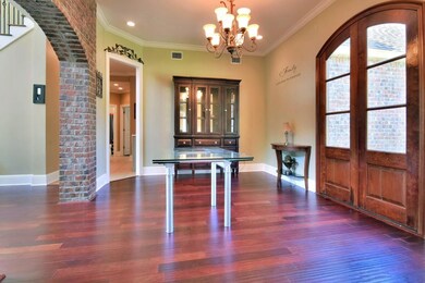 Dining Room with wood floors, wrought iron chandel