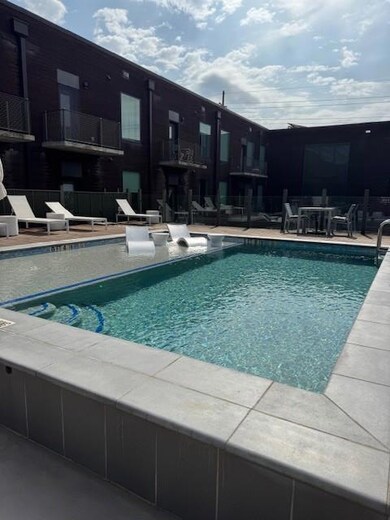Community pool with a patio area