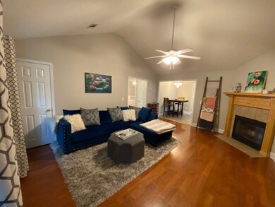 Great Room with hardwood floors, vaulted ceiling,
