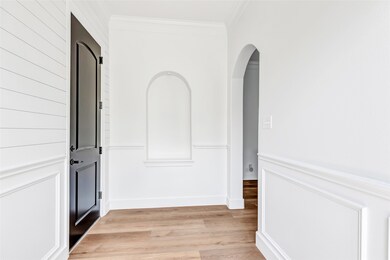 Formal entry way with updated flooring, fresh pain