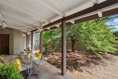 Cozy patio for coffee or dinners with twinkly lights...large door takes you into the living room